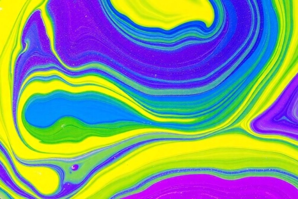 Swirls of purple, blue, yellow, and green paints.